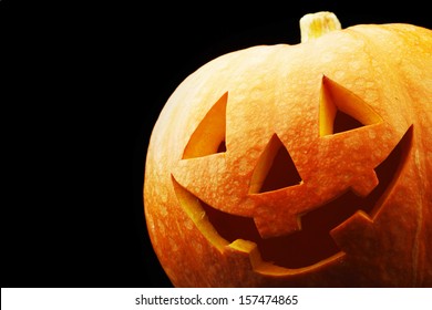 Halloween funny Jack-o-lantern over black background