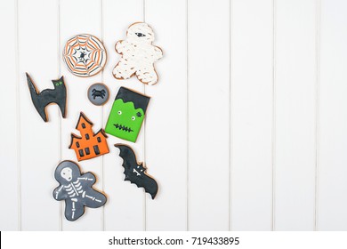 Halloween Gingerbread Cookies On The White Wooden Table. Top View. Copyspace.