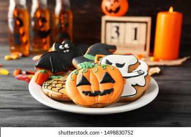 Halloween gingerbread cookies in plate on wooden table - Powered by Shutterstock