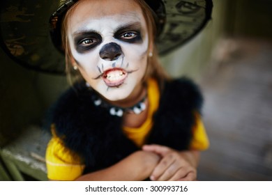 Halloween Girl With Painted Face Looking At Camera