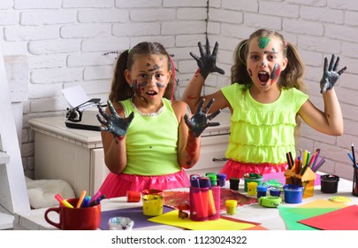 Halloween Girls With Scary Faces Colored With Paints. Children With Zombie Painted Hands. Kids Learning And Playing. Body Art And Painting. Entertainment, Cosplay Party And Holiday.