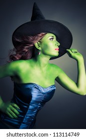 Halloween green witch on a grey background