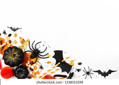 Halloween Holiday Background With Colorful Candy, Bats, Spiders, Pumpkins And Decorations. Flat Lay. View From Above