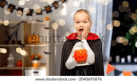 Similar – Foto Bild Happy Halloween.überrascht Kind in einem Skelett-Kostüm mit Popcorn gegen orange Hintergrund