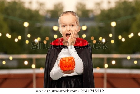 Similar – Foto Bild Happy Halloween.überrascht Kind in einem Skelett-Kostüm mit Popcorn gegen orange Hintergrund