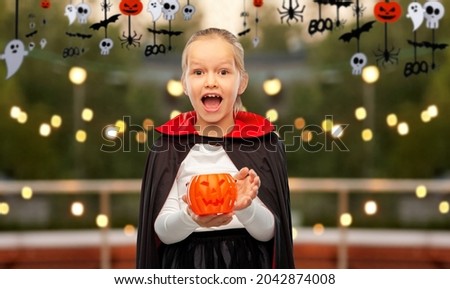 Similar – Foto Bild Happy Halloween.überrascht Kind in einem Skelett-Kostüm mit Popcorn gegen orange Hintergrund