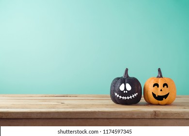 Halloween holiday concept and jack o lantern glitter pumpkin decor wooden table