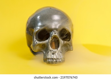 Halloween Holiday Concept. Scary Skull On Yellow Background. Selective Focus