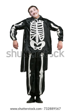 halloween, holidays, all saints day concept. on white background isolated cute funny guy is dressed up like a skeleton and has special make up, he is making excellent pantomime show