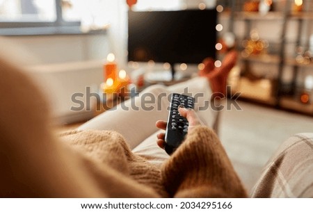 Similar – Image, Stock Photo Young woman sitting on a park bench laughing with a book