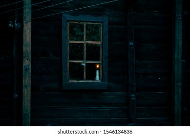 Halloween Horror Building. Reflection And Shadows Of A Spooky Tree In The Window Of An Old Wooden Dark Mystical Ghostly House In The Forest And The Light From A Lamp In Night Darkness