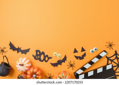Halloween Horror Movie Night Background  With  Pumpkin, Decorations And Movie Clapper Board. Top View, Flat Lay