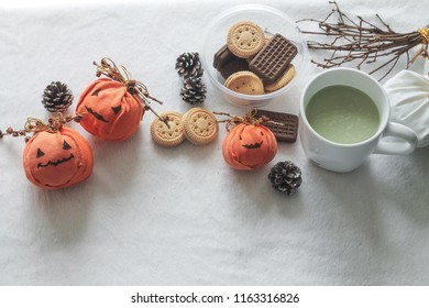 Halloween Inspired Snacks Of Pumpkin Biscuits And Macha Tea