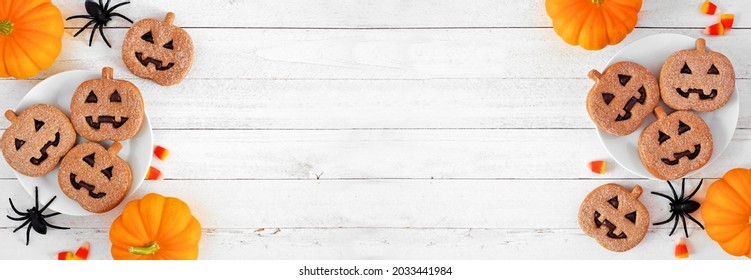 Halloween Jack O Lantern Cookie Double Border. Chocolate And Pumpkin Spice. Overhead View With Decor On A White Wood Background. Copy Space.