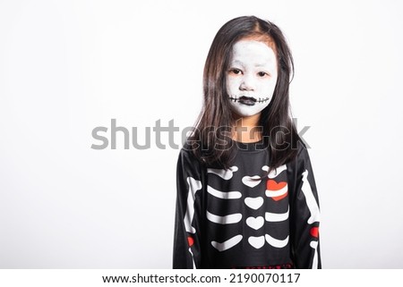 Halloween Kid. Portrait of Asian little kid girl wearing witch costume studio shot isolated white background, Child woman horror face painting make up for scary, Happy halloween day concept