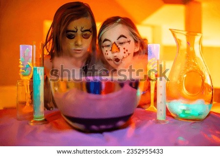 Halloween kids party and potions with glowing liquid and smoke
