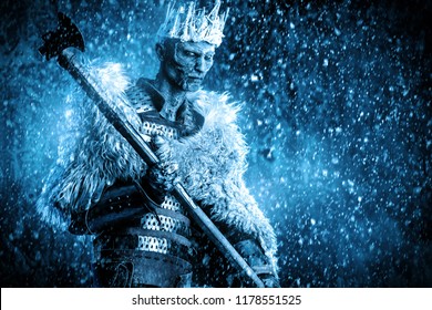 Halloween. The King Zombie Warrior In The Armor Of A Medieval Knight Covered With Snow. Horror Fantasy Film.