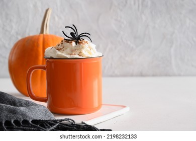 Halloween latte coffee with whipped cream decorated spiders and pumpkin on white background. Copy space. Close up. - Shutterstock ID 2198232133