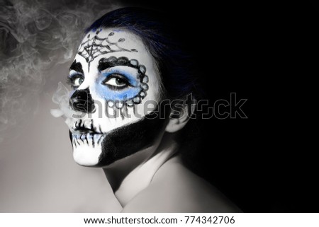 Halloween make up sugar skull Santa Muerte concept. Black and white with blue
