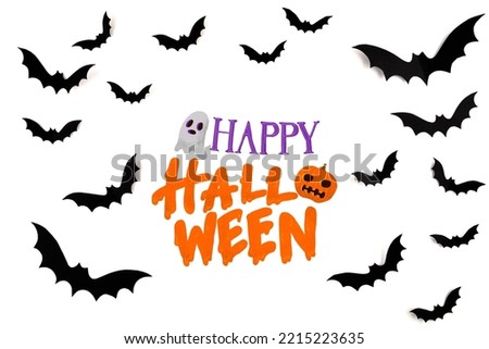 Halloween mock concept. Flaying black paper bats on white background.