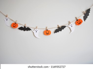 Halloween Paper Garland With Ghost, Pumpkin And Bat Hanging On The Wall. Easy Crafts For Kids.