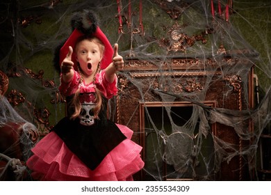 Halloween party at the haunted castle. A pretty girl in a pirate costume is very surprised, showing thumbs up. Place for text.
