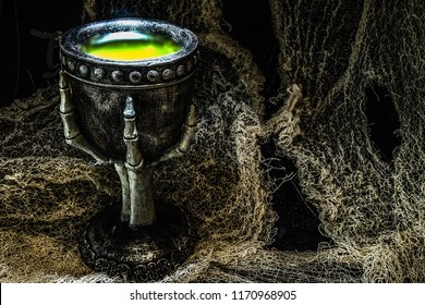 Halloween pewter cup with a green potion.