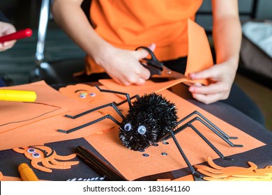 Halloween Preparation Kids Craft Concept. Little Children Doing  Crafts At Home Halloween Party