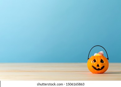 Halloween Pumpkin Bucket On A Blue Background