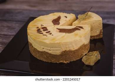 Halloween pumpkin cheesecake scary old jack-o-lantern with piece cut off - Shutterstock ID 2201245017