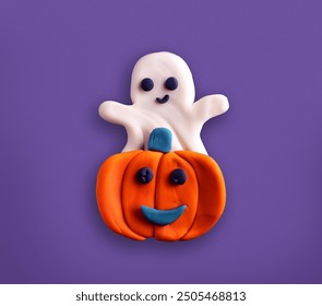 Halloween Pumpkin with cute Ghost molded from plasticine modeling clay isolated on purple background, kids toy, kids fun concept, Halloween concept, smiling  jack o lantern