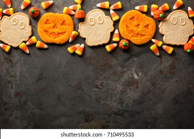 Halloween Pumpkin And Ghosts Cookies And Candy Overhead Shot With Copy Space