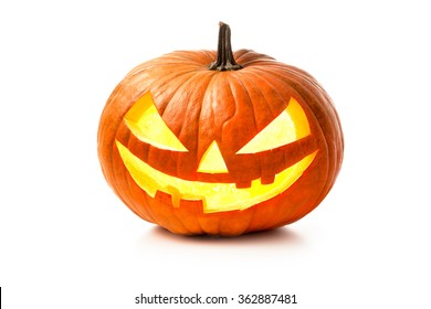 Halloween pumpkin head jack lantern with burning candles isolated on white background