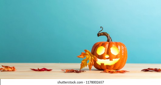 Halloween Pumpkin With Leaves On A Blue Background