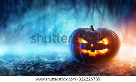 Halloween Pumpkin In A Mystic Forest At Night 