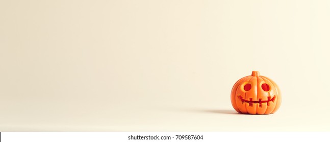 Halloween Pumpkin Ornament On An Off White Background