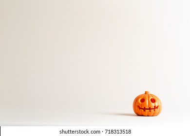 Halloween Pumpkin Ornament On An Off White Background