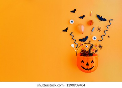 Halloween pumpkin with Halloween party objects, overhead view - Powered by Shutterstock