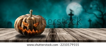 Halloween pumpkins with cementery and night sky with clouds and moon background