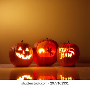 Halloween Pumpkins with Cowboy Carvings - Powered by Shutterstock