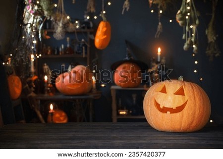 Halloween pumpkins on old wooden table on background Halloween decorations