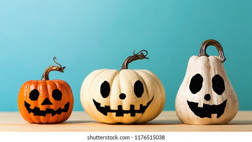 Halloween Pumpkins On A Table On A Blue Background