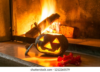 Halloween Pupkin And Candy On A Fireplace