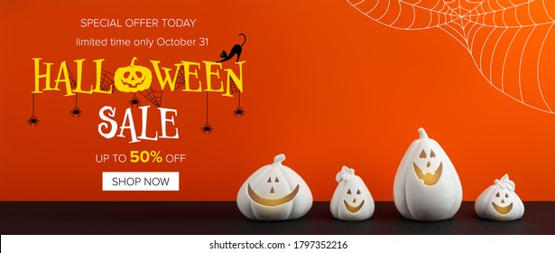 Halloween Sale Banner With White Pumpkin Shaped Candle Holders On Bright Orange Background 