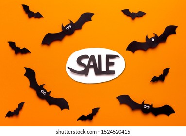 Halloween Sales Concept. Flying Paper Bats On Orange Background With Promo Text