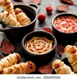 Halloween Sauce Made Of Ketchup And Mustard Decorated With A Cobweb Drawing, A Close-up View. Idea For A Halloween Food