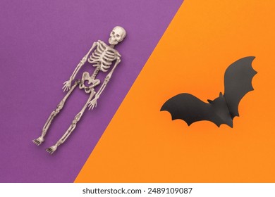 Halloween Skeleton and Bat on Purple and Orange Background - Powered by Shutterstock