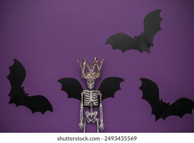 Halloween Skeleton with Crown Surrounded by Bats on Purple Background - Powered by Shutterstock