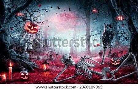 Halloween - Skeletons In Spooky Forest At Moonlight - Jack O’ Lantern  In Cemetery At Twilight