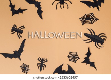 Halloween is a spooky holiday that is celebrated with decorations and costumes. A variety of Halloween themed cutouts, including bats, spiders, and other creepy creatures. Scene is dark and eerie - Powered by Shutterstock